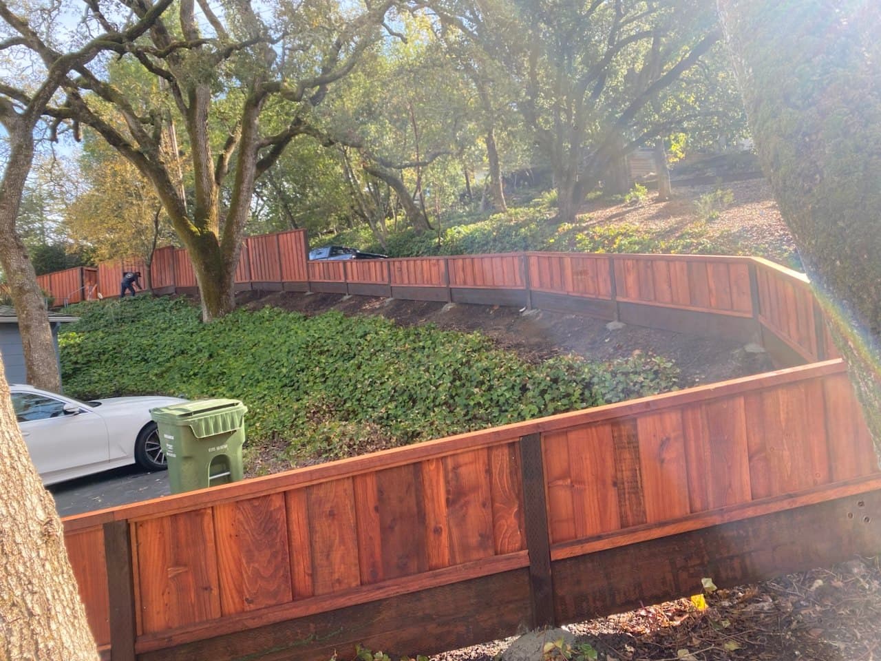 Board On Board Fence Up Hill Stained